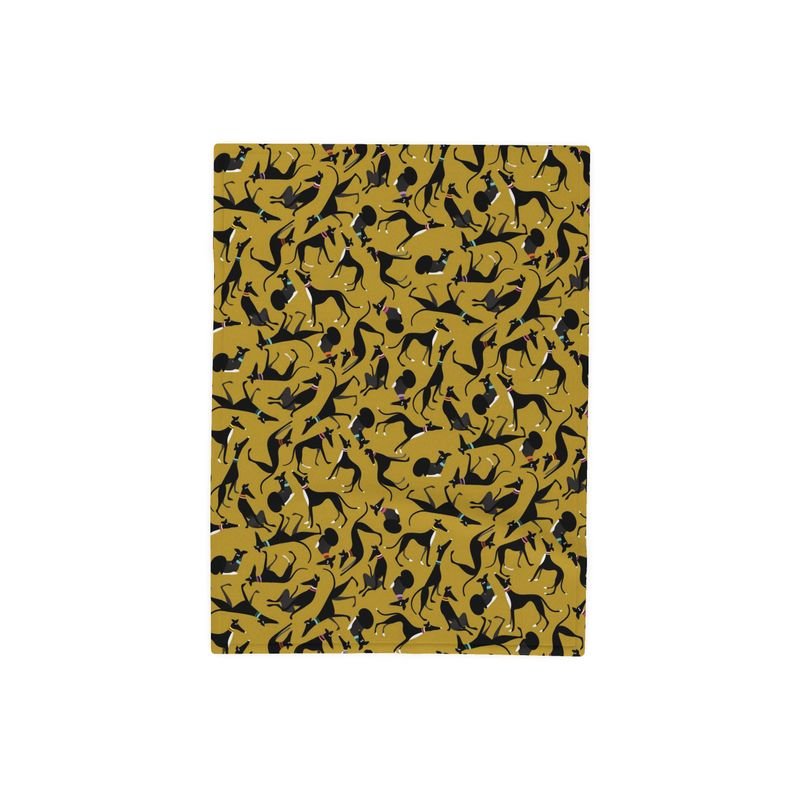 Top side of a fleece blanket. The background colour is lime. There is a repeat pattern with many cute black greyhounds in a variety of poses.