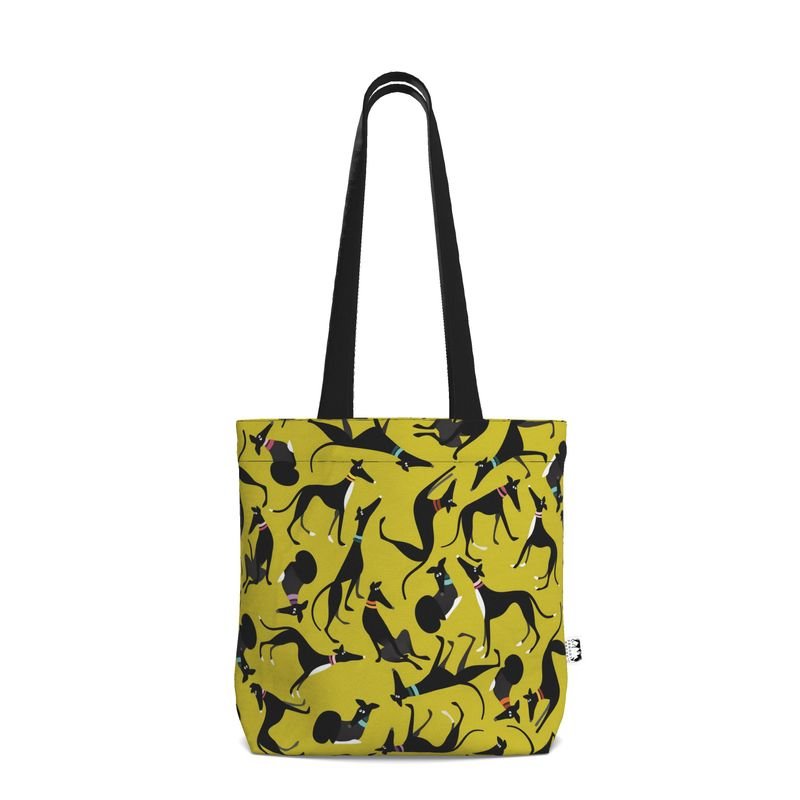 Front view of a Lime tote shopper with a black handle. The repeat pattern on the main body of the shopper is a repeat pattern cute illustrations of black and white greyhounds in various poses.