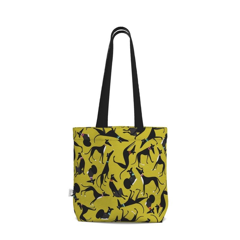 Back view of a Lime tote shopper with a black handle. The repeat pattern on the main body of the shopper is a repeat pattern cute illustrations of black and white greyhounds in various poses.