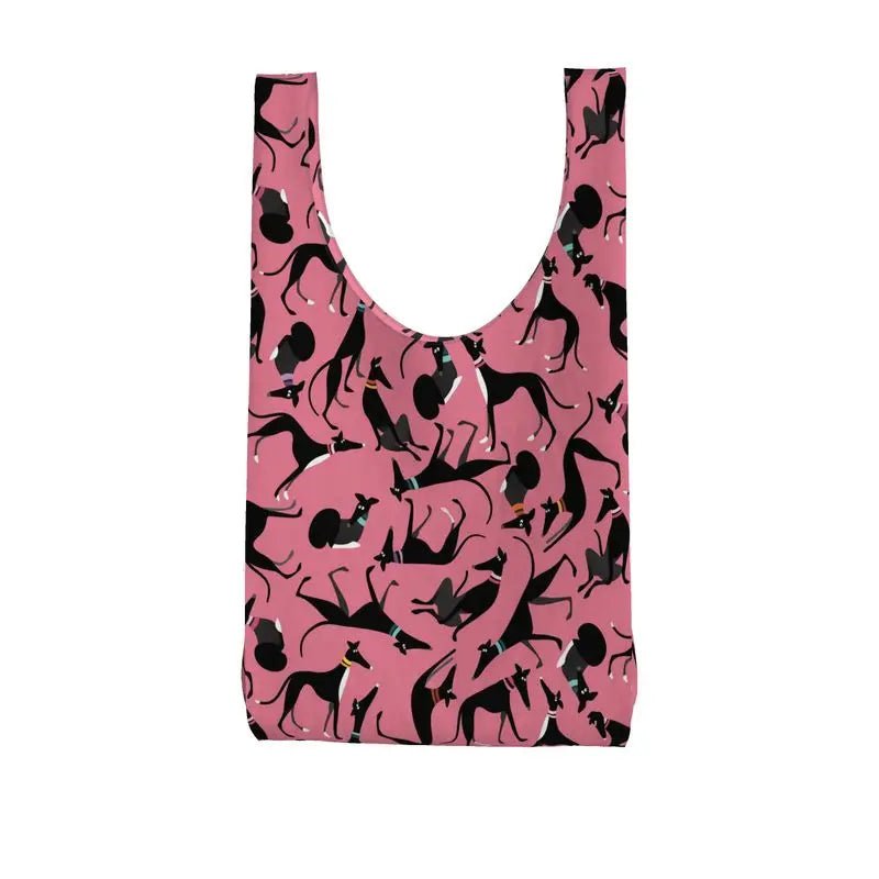back view of a Parachute shopping bag with a pink background. The repeat patterns shows lots of cute illustrations of black & White greyhounds in different poses.