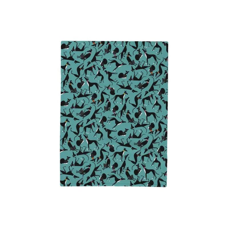 Top side of Fleece blanket with a turquoise background. The repeat patterns shows lots of cute illustrations of black & White greyhounds in different poses.
