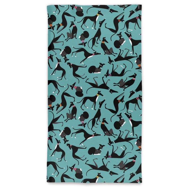 Front image of tube neck scarf with a turquoise background. The pattern is a repeat pattern of cute black and white greyhounds in various poses.