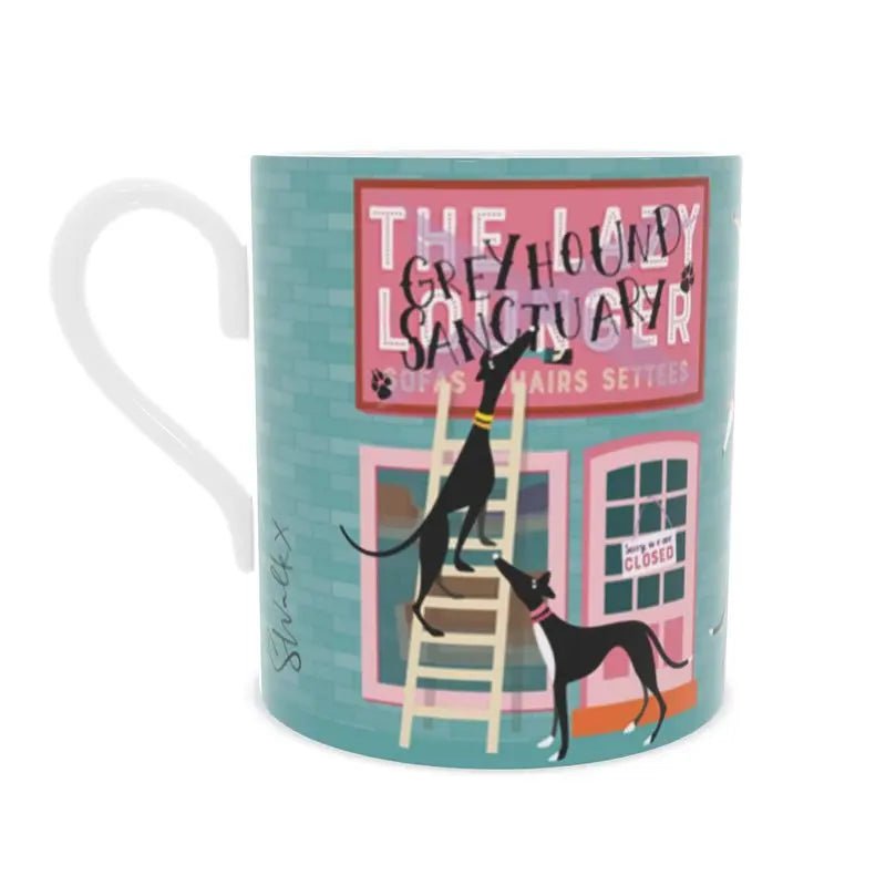 Back view of a bone china mug. The background is turquoise with a brick motif. The image shows the front of a sofa shop called the Lazy Lounger. It is currently closed. There is a greyhound standing up a ladder with a paintbrush in their mouth. They have painted 'Greyhound Sanctury' over the top of the shop sign. There is a 2nd greyhound keeping watch.