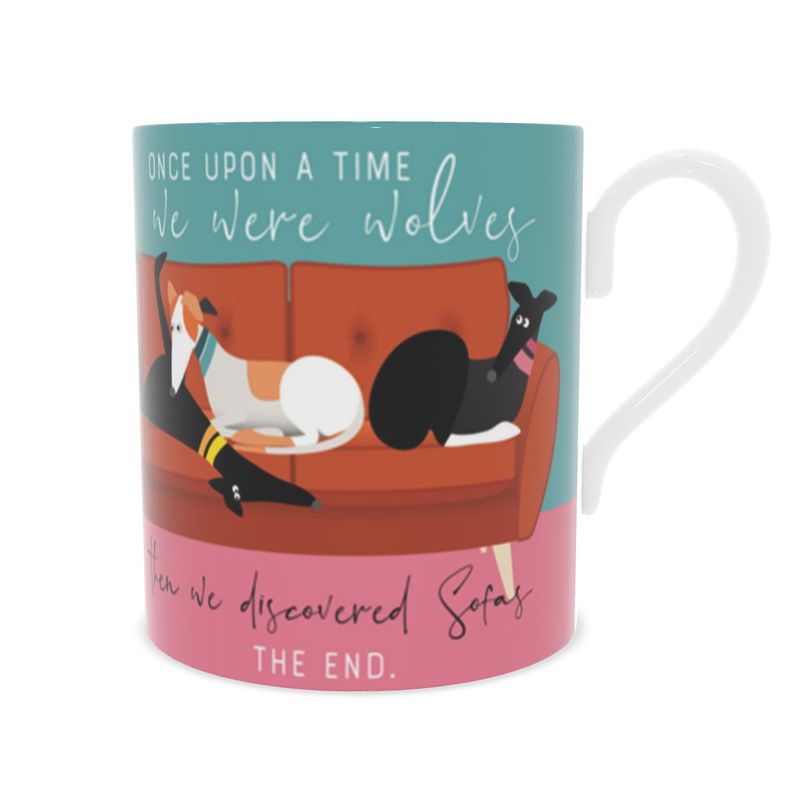 Front view of a bone china mug. The background is turquoise and pink.. Wrapped around the mug is an illustrations of 6 greyhounds on a 5 seat orange sofa. On the front and back of the mug the text reads; Once upon a time we were wolves. Then we discovered sofas. The End.