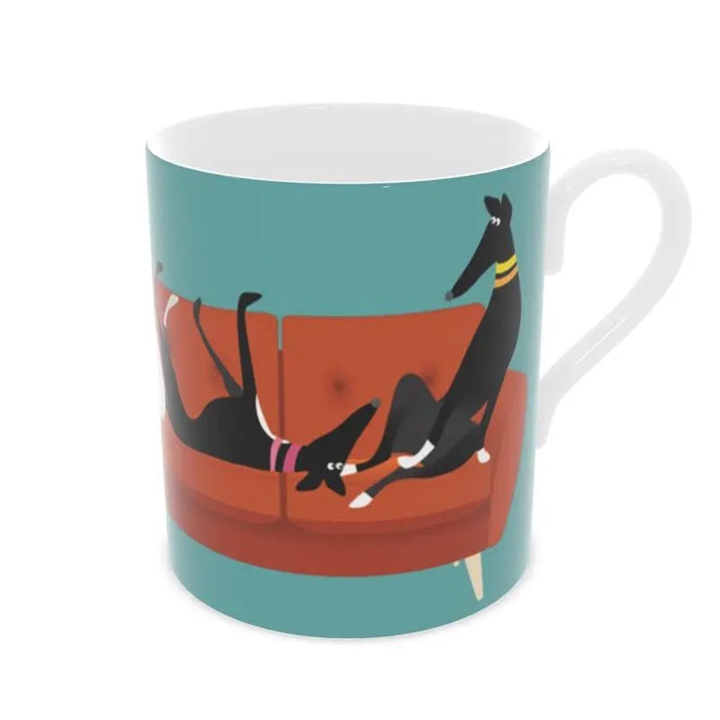 front view of a bone china mug. The background is Turquoise. there is an image of 5 greyhounds sitting on a 4 seat orange sofa.