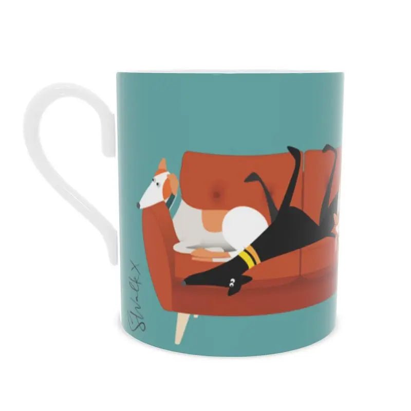 Back view of a bone china mug. The background is Turquoise. there is an image of 5 greyhounds sitting on a 4 seat orange sofa.