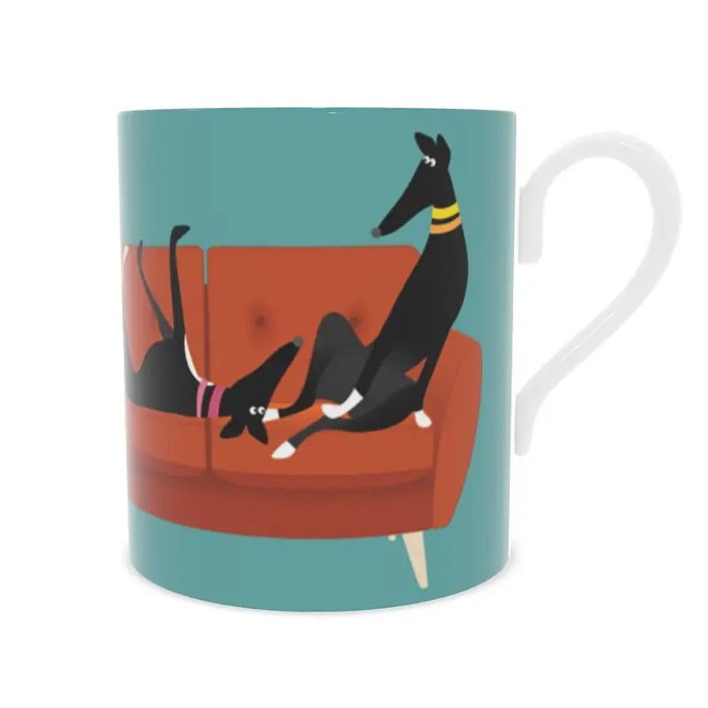front view of a bone china mug. The background is Turquoise. there is an image of 5 greyhounds sitting on a 4 seat orange sofa.