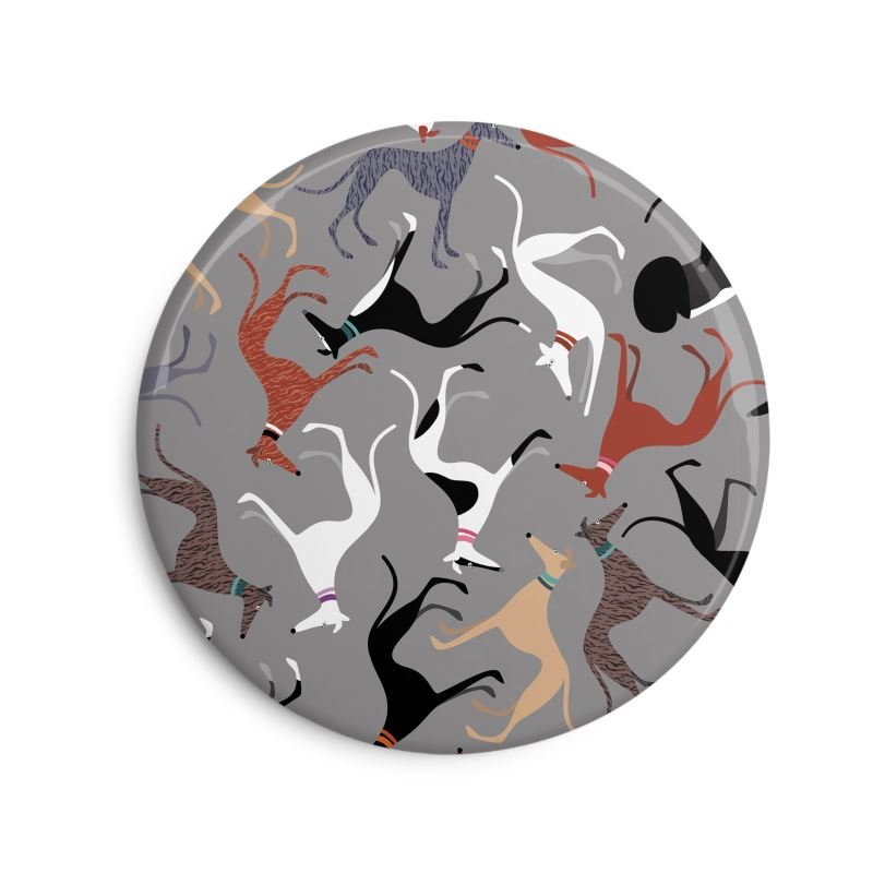 Fridge Magnet. 6cm Round. Grey background with repeat pattern showing illustrations of cute greyhounds with coat colours.